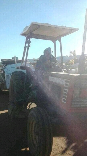 A Timorese worker is doing his work in a garden in Australia