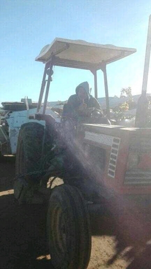 A Timorese worker is doing his work in a garden in Australia